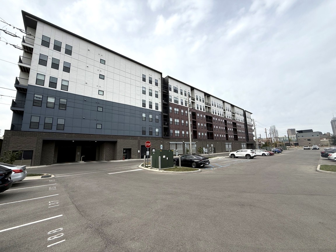 Rear elevation of Rise on Meridian in Indianapolis, above a parking area