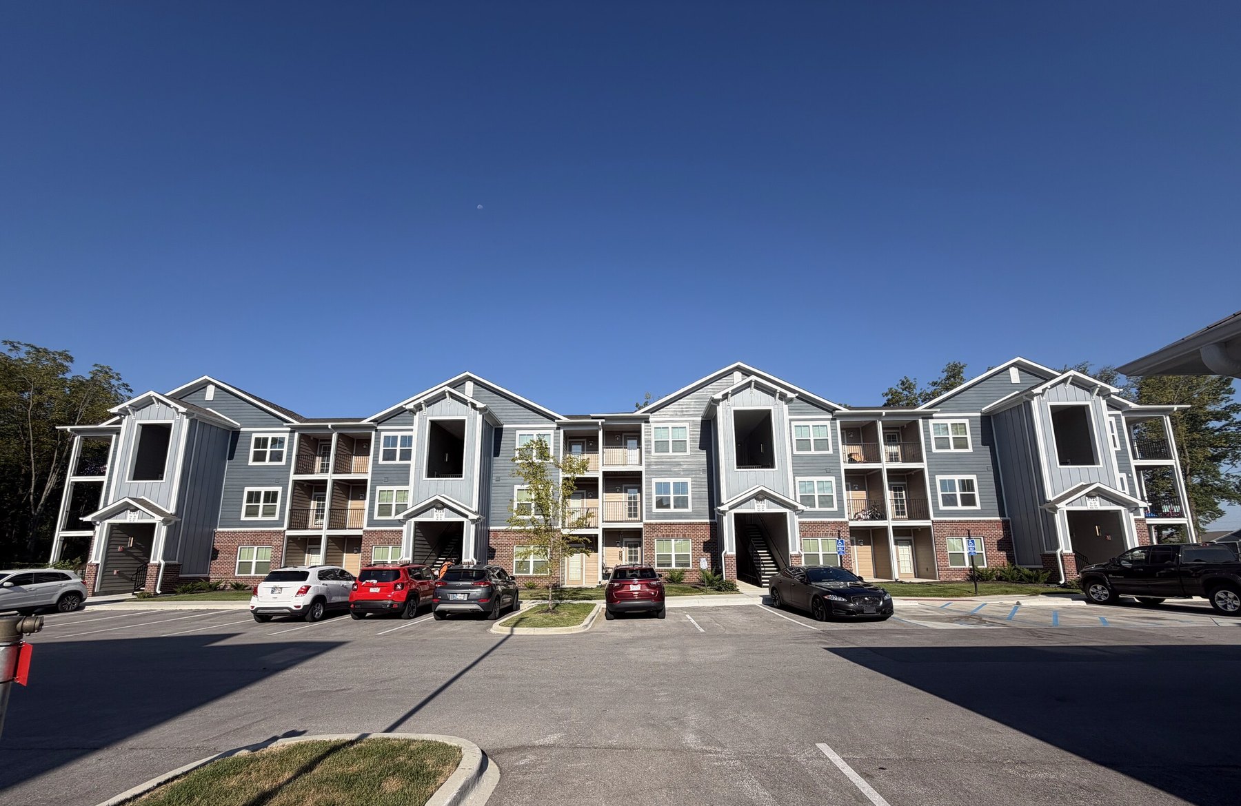 City Heights apartment buildings and parking area, wide view